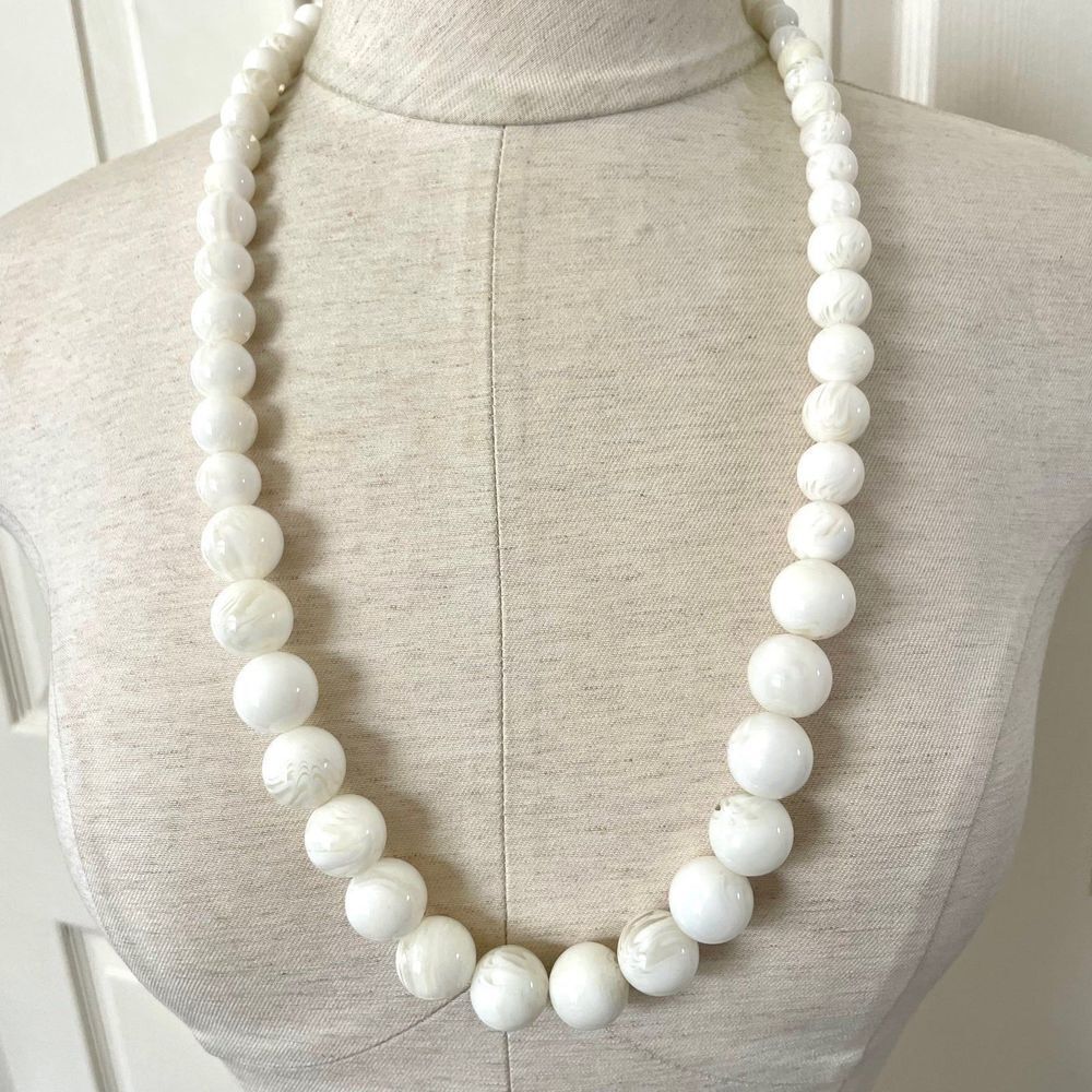Long white beaded necklace